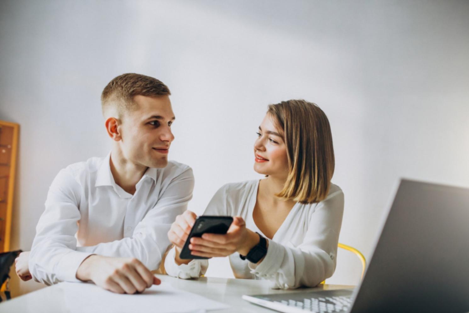 Professional business consultation session showing budget analysis and compliance review